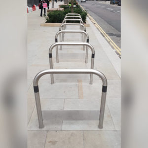Curved cycle stand for two bicycles