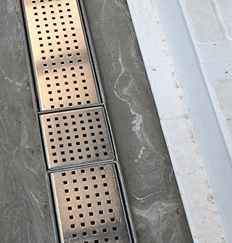 Stainless steel drain gratings by Kent